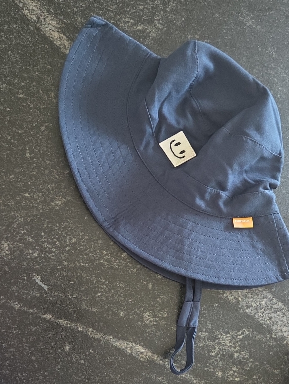 Navy Bucket Hat with Smile Patch and Orange Tab